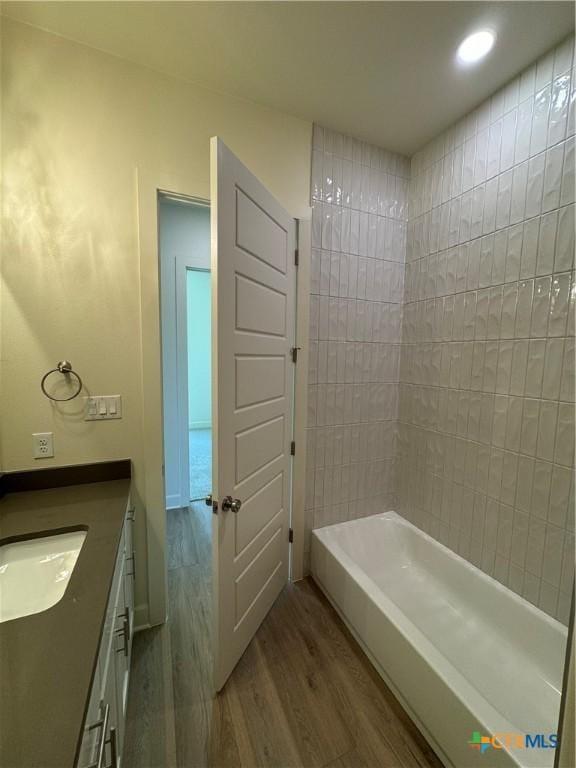 5903 Whippoorwill Rd, Temple, TX 76502 - full bathroom with wood finished floors, vanity, and recessed lighting