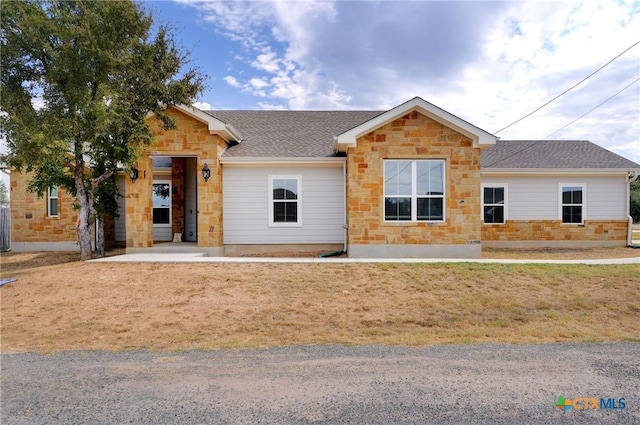 1512 Stonecrest Dr, Granite Shoals, TX 78654 - single story home featuring stone siding, roof with shingles, and a front yard