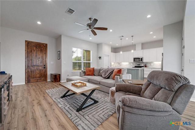 1512 Stonecrest Dr, Granite Shoals, TX 78654 - living room featuring light wood finished floors, ceiling fan, recessed lighting, and baseboards