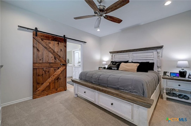1512 Stonecrest Dr, Granite Shoals, TX 78654 - bedroom featuring light colored carpet, a barn door, recessed lighting, ensuite bath, and a ceiling fan