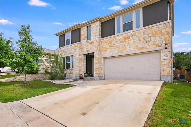 229 Mary Max Cir, San Marcos, TX 78666 - view of front of home with stone siding, a garage, driveway, and a front yard