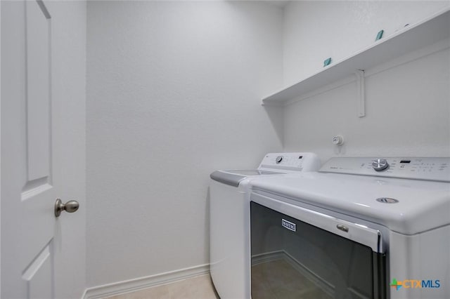 229 Mary Max Cir, San Marcos, TX 78666 - washroom with washing machine and dryer and baseboards