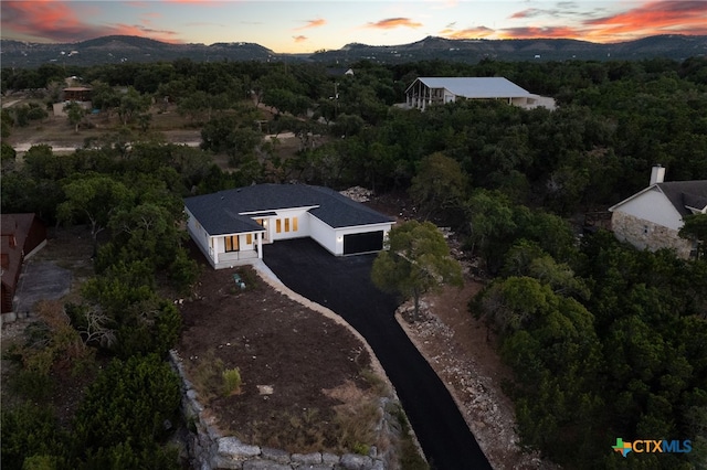 aerial view at dusk with a mountain view