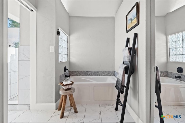 2201 Fuller Ln, Harker Heights, TX 76548 - full bath with marble finish flooring, a garden tub, and healthy amount of natural light
