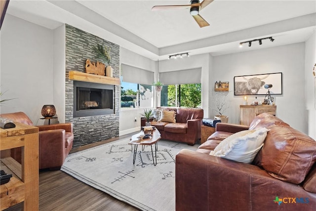 2201 Fuller Ln, Harker Heights, TX 76548 - living room featuring a ceiling fan, a fireplace, rail lighting, and wood finished floors