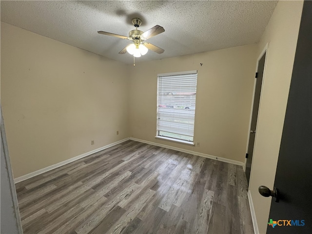 unfurnished bedroom featuring ceiling fan, wood-type flooring, and a textured ceiling