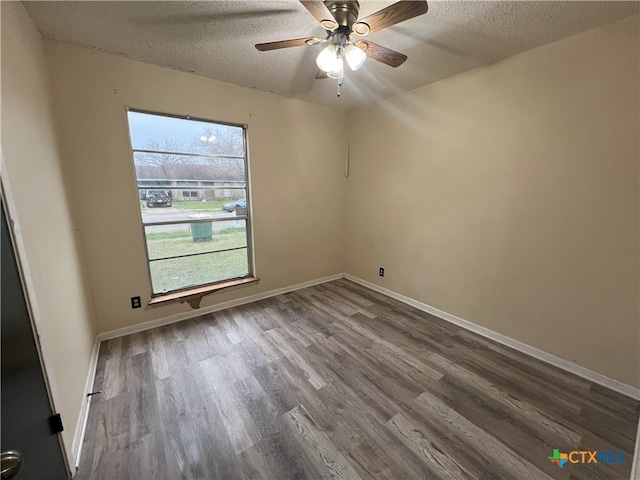 unfurnished room featuring hardwood / wood-style floors, ceiling fan, and a textured ceiling