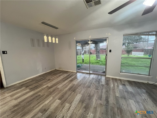 interior space featuring dark hardwood / wood-style flooring and ceiling fan