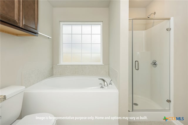 bathroom with toilet and shower with separate bathtub