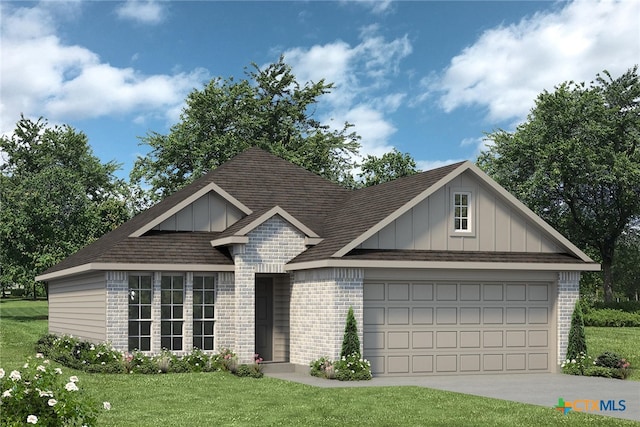 view of front of property with a garage and a front lawn