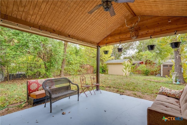 view of patio with a storage unit and ceiling fan