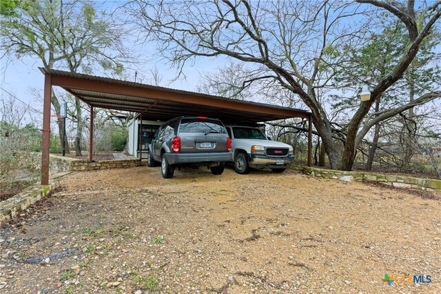 view of parking featuring a carport