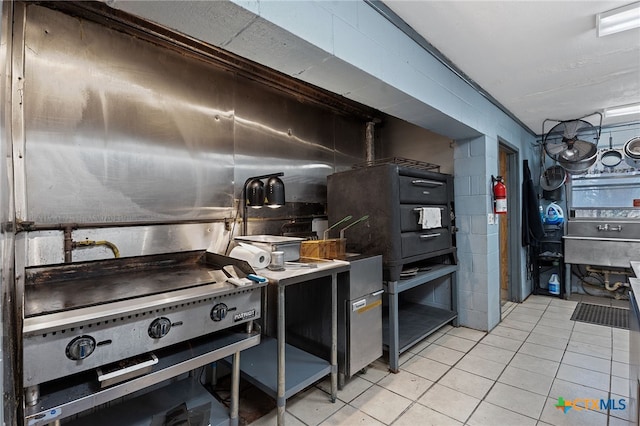 kitchen featuring light tile patterned flooring