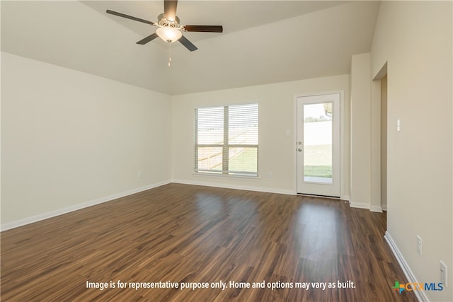 spare room with dark hardwood / wood-style floors, ceiling fan, and vaulted ceiling