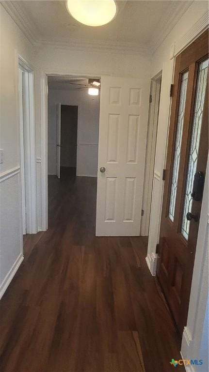 hall with crown molding and dark hardwood / wood-style flooring