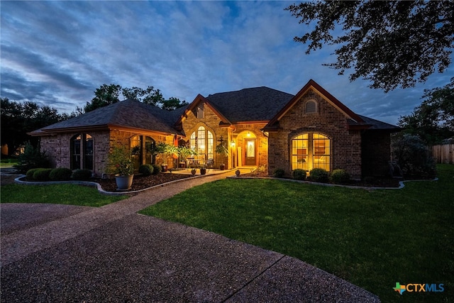 view of front of home with a lawn