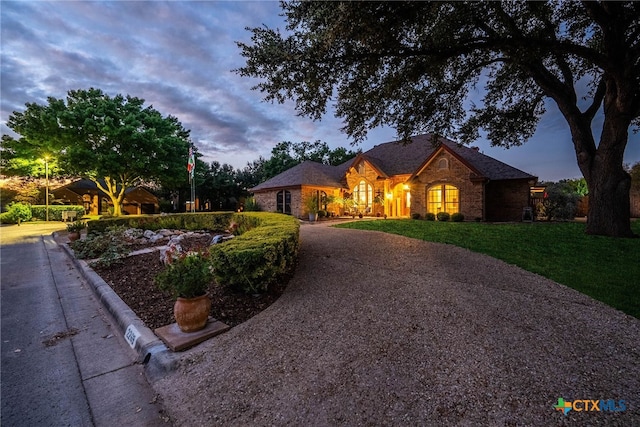 single story home featuring a yard