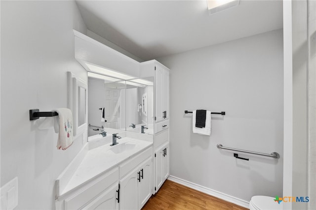 bathroom with wood-type flooring and vanity