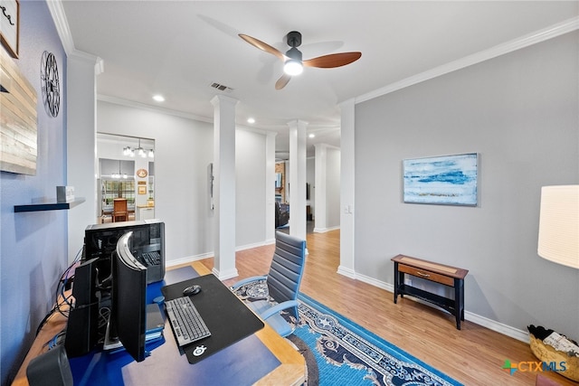 office area with ceiling fan, wood-type flooring, ornate columns, and crown molding