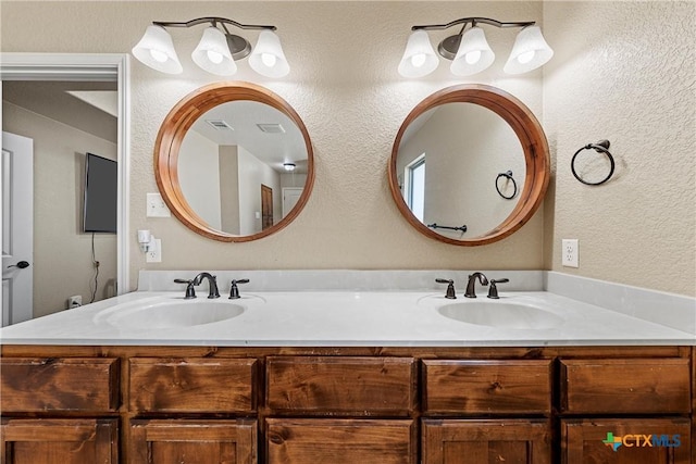 2515 Alpine Fir Dr, Harker Heights, TX 76548 - bathroom with double vanity and a textured wall