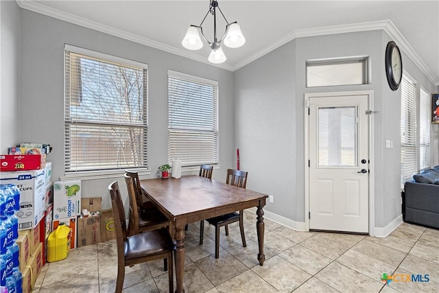 tiled dining area featuring crown molding and a chandelier