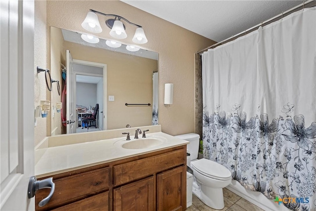 bathroom featuring vanity, toilet, tile patterned floors, a textured ceiling, and a shower with shower curtain