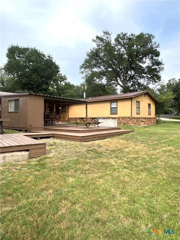 6769 Cedar Cove Rd, Belton, TX 76513 - rear view of property with a deck and a yard