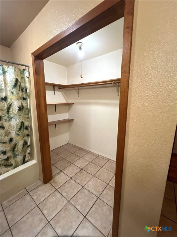 6769 Cedar Cove Rd, Belton, TX 76513 - walk in closet with light tile patterned flooring
