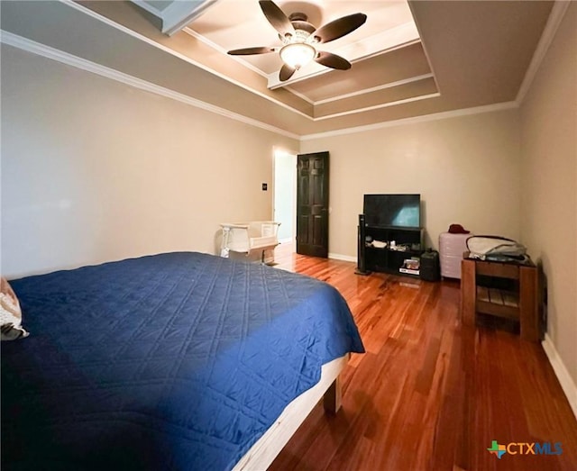 1106 Bowen Ave, Copperas Cove, TX 76522 - bedroom featuring wood finished floors, ornamental molding, a raised ceiling, ceiling fan, and baseboards