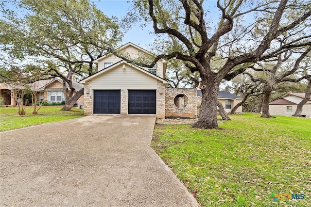 view of front of house with a garage and a front lawn