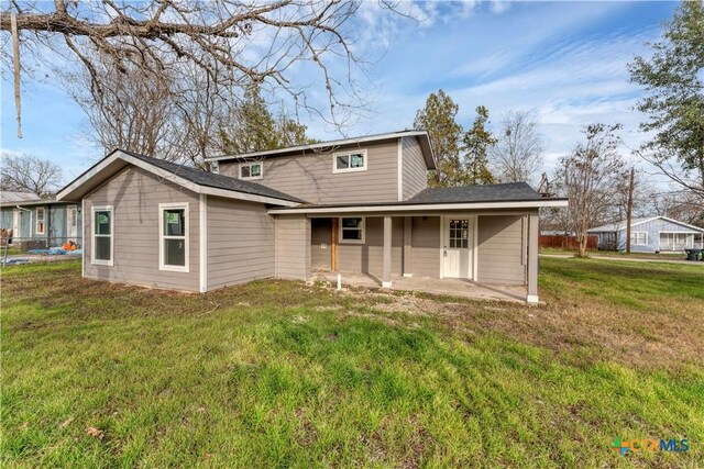 414 Ellis St, Seguin, TX 78155 - rear view of property with a patio area and a yard