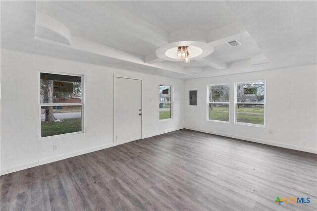 414 Ellis St, Seguin, TX 78155 - unfurnished room featuring coffered ceiling, wood finished floors, beamed ceiling, baseboards, and visible vents
