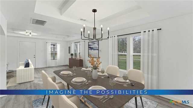 414 Ellis St, Seguin, TX 78155 - dining space with a raised ceiling, wood finished floors, and visible vents