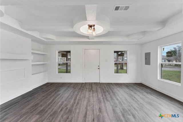 414 Ellis St, Seguin, TX 78155 - unfurnished living room featuring electric panel, a wealth of natural light, visible vents, and built in features