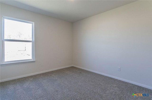 3817 Poteet Ct, Temple, TX 76504 - empty room featuring a wealth of natural light, baseboards, and carpet