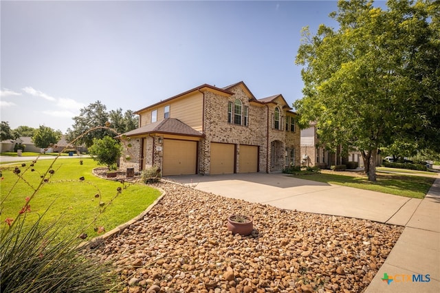 view of front facade featuring a front lawn and a garage