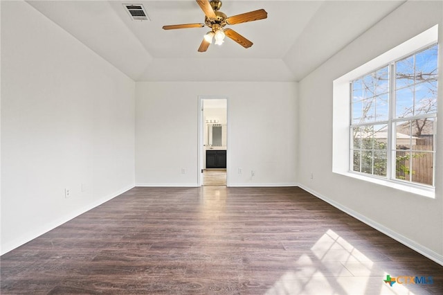 unfurnished room featuring lofted ceiling, dark wood-type flooring, and ceiling fan