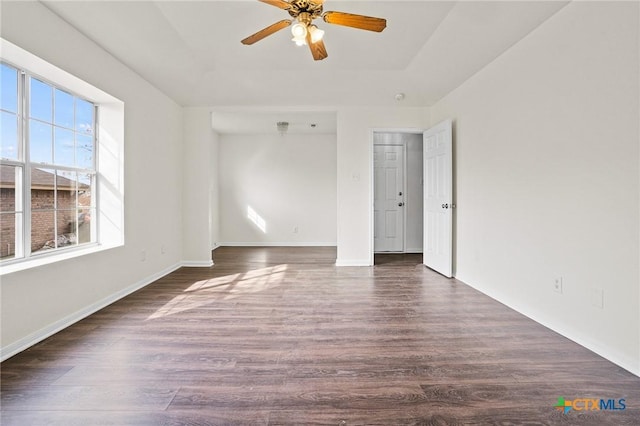 unfurnished room featuring ceiling fan and dark hardwood / wood-style floors