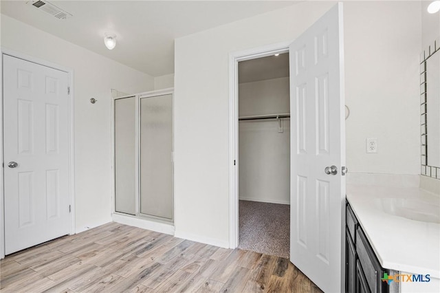 interior space featuring light wood-type flooring and sink