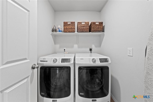 laundry room with independent washer and dryer