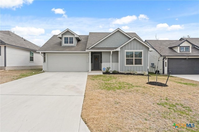 view of front of property with a garage and a front yard