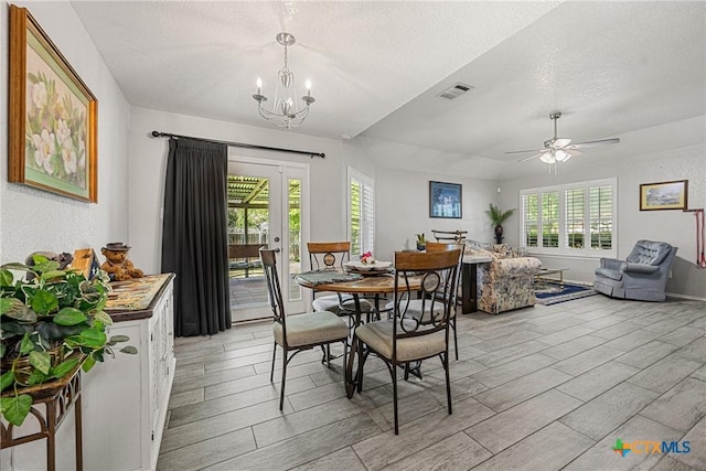504 Surghnor St, Belton, TX 76513 - dining space featuring wood tiled floors, a chandelier, a textured ceiling, a ceiling fan, and french doors