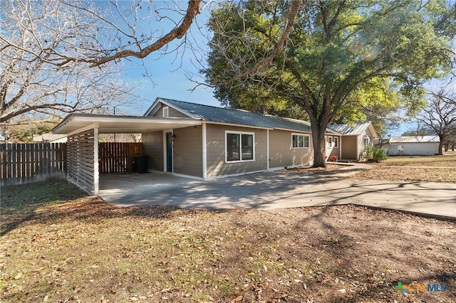 exterior space with a carport