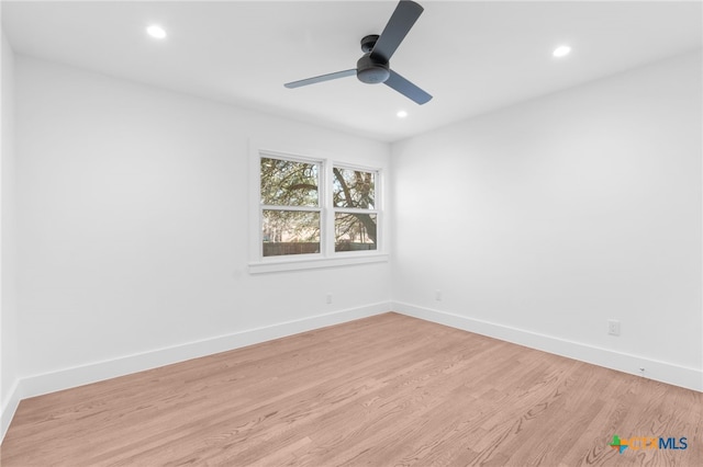 empty room with light hardwood / wood-style floors and ceiling fan