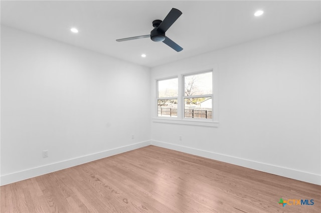 empty room with light hardwood / wood-style floors and ceiling fan