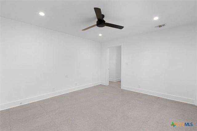 spare room with ceiling fan