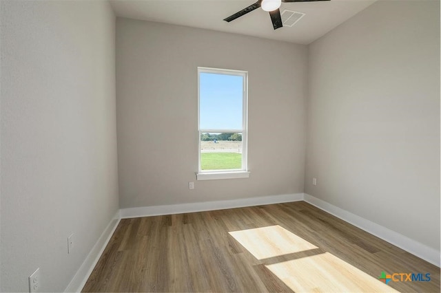 empty room featuring ceiling fan and light wood-type flooring