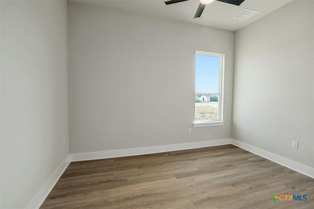 unfurnished room featuring hardwood / wood-style floors and ceiling fan