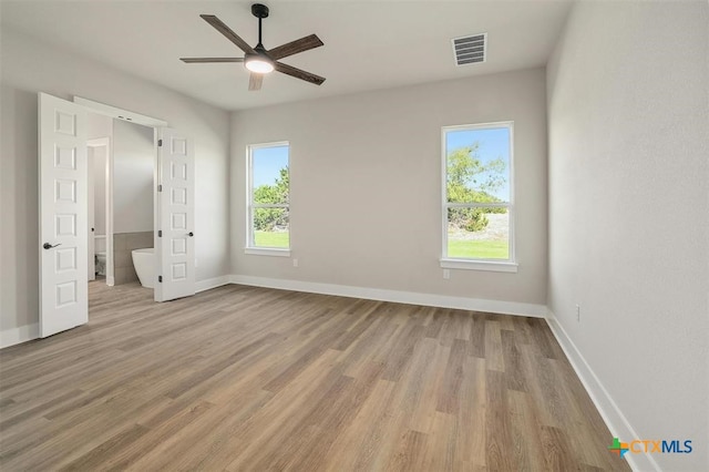 unfurnished bedroom featuring ceiling fan and light hardwood / wood-style floors