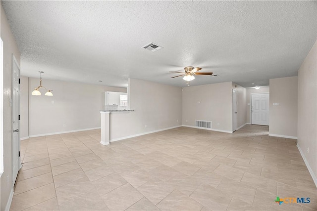 4104 Matt Ct, Killeen, TX 76549 - unfurnished living room with a ceiling fan, a textured ceiling, baseboards, and light tile patterned flooring